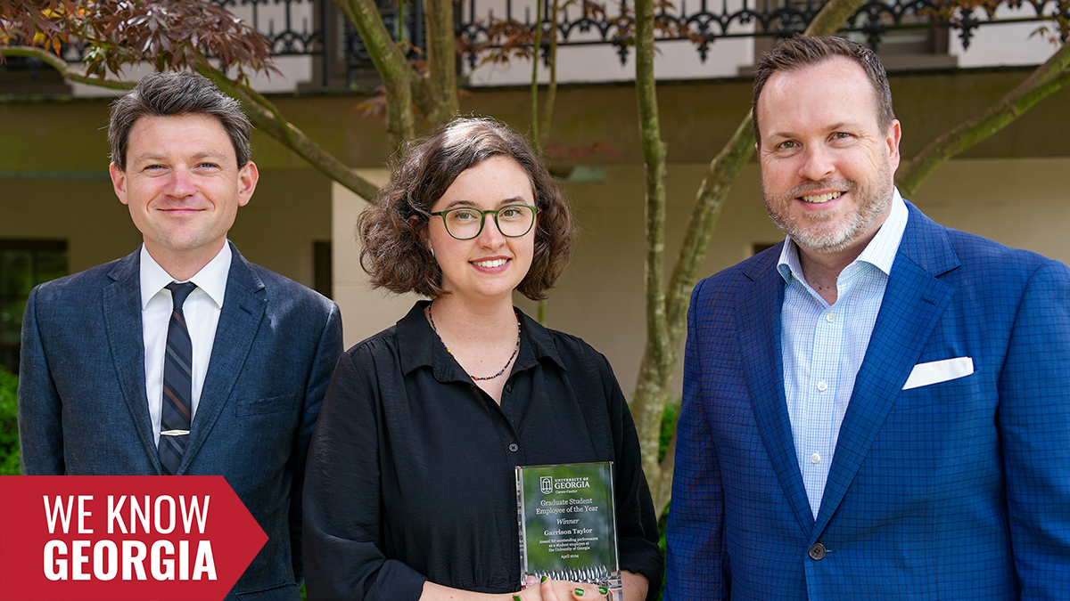 Garrison Taylor, Grad Student of the Year, stands with Director Rob Gordon and her nominator, Clark Stancil