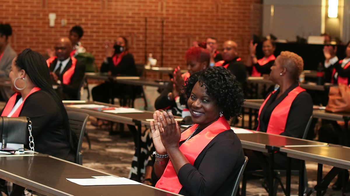 CPM grad smiling at graduation